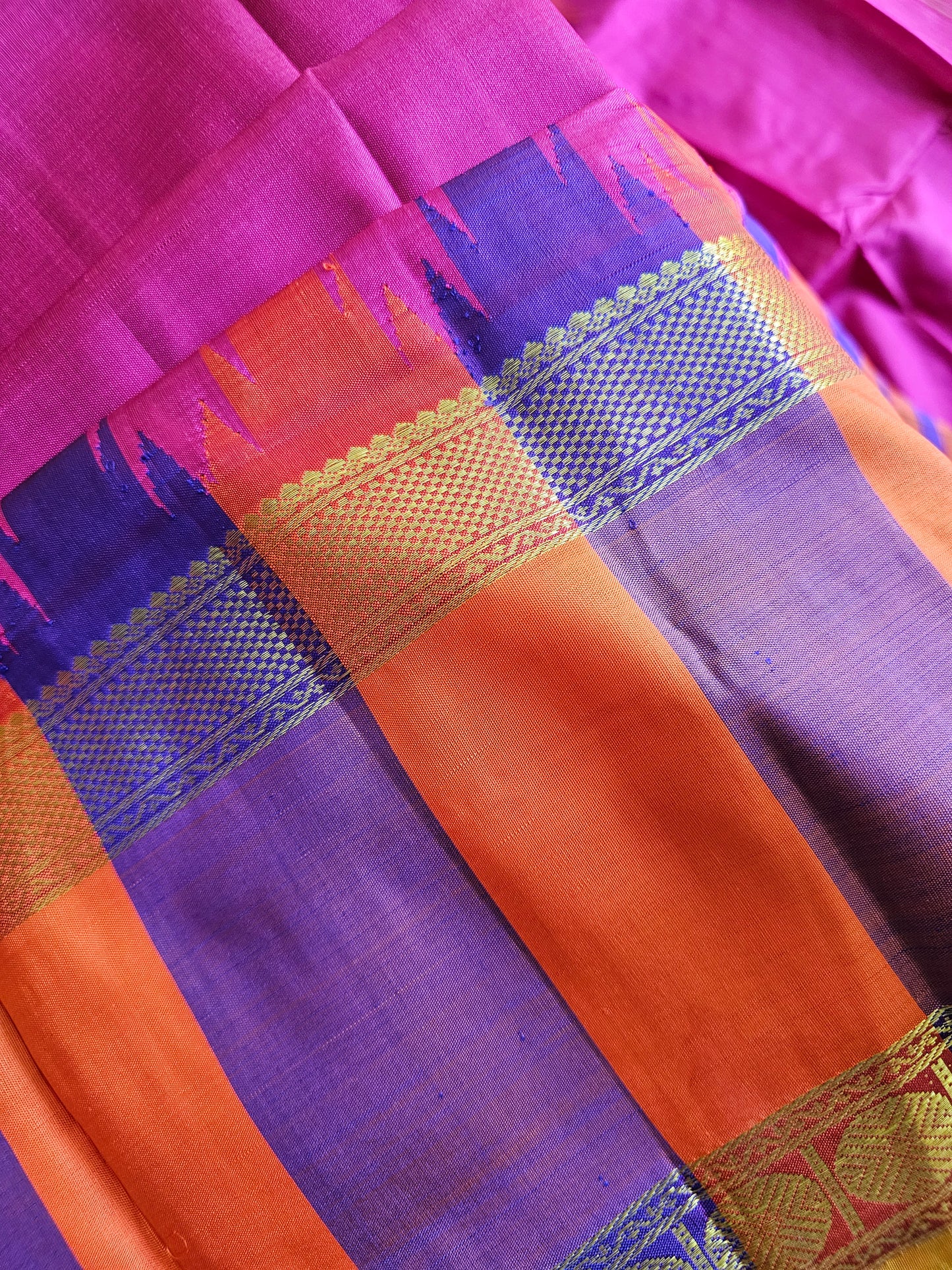 Pure Kanchi Pattu - Pink with orange and purple reeta peet borders