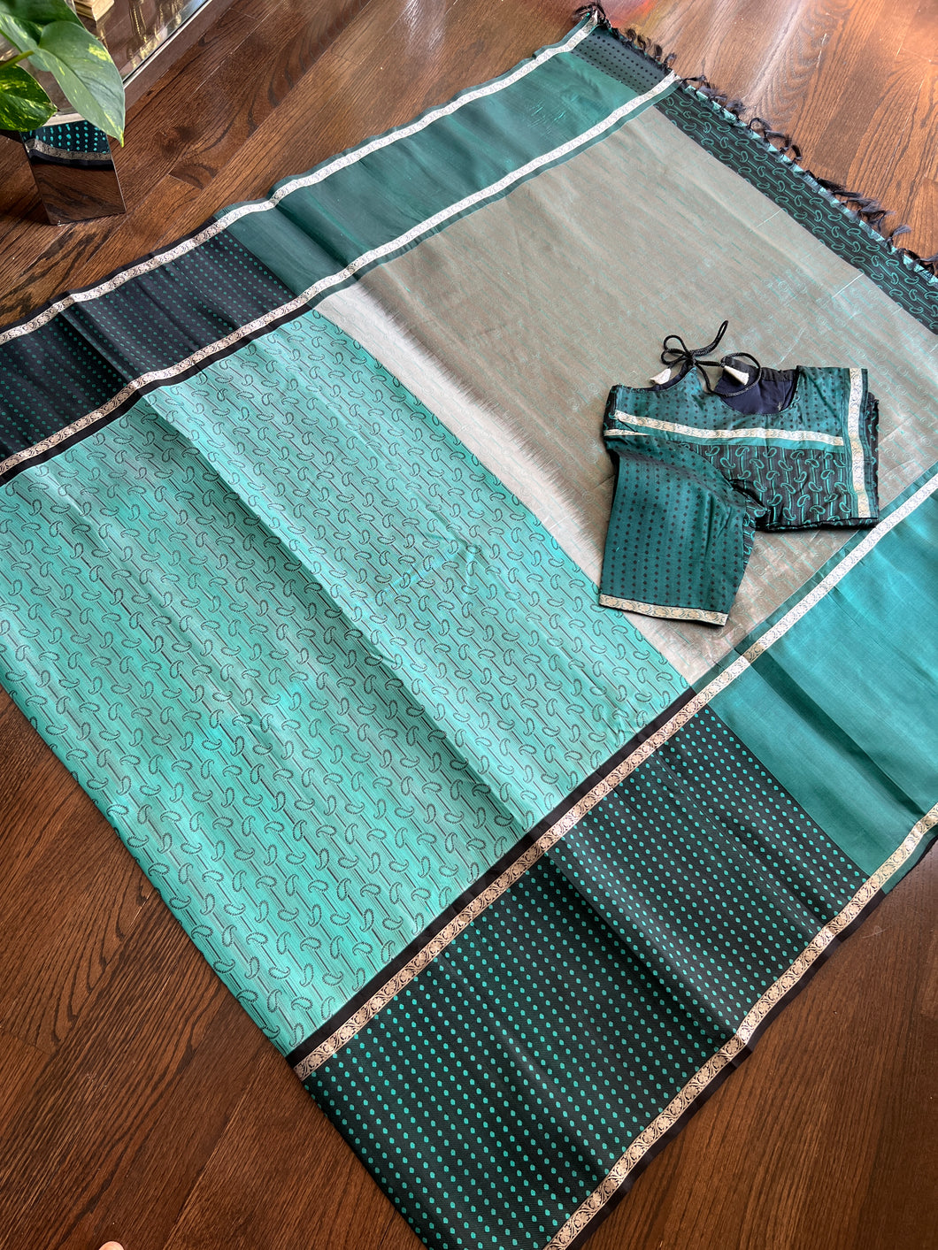 A Pure Sea green soft silk along with embossed patter and silver border